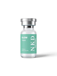 a bottle of nkd glow serum on a white background
